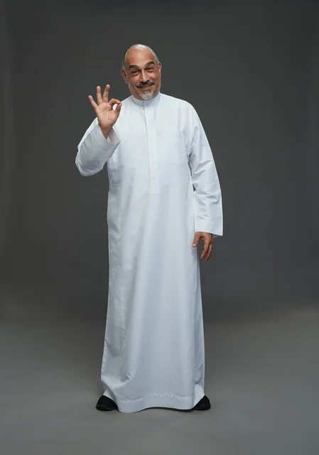Saudi Man in White Thobe Making Okay Gesture
