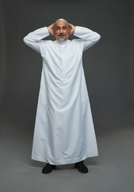 Arab Man in White Thobe Smiling on Grey Background