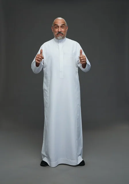Saudi Man in Traditional Thobe Giving Thumbs Up