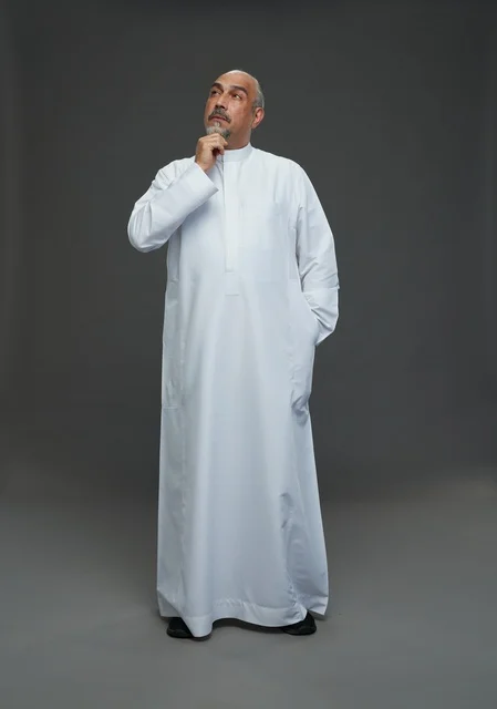 Middle-aged Saudi Man Thinking in White Thobe Studio