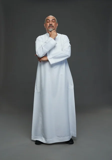 Middle-Aged Arab Man Thinking in White Thobe Portrait