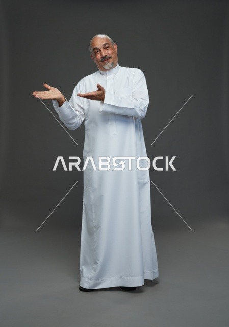 Middle Aged Arab Man Presenting In White Studio Thobe