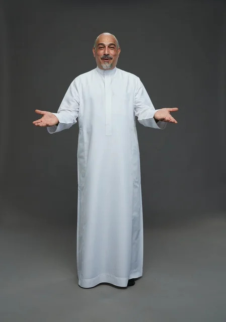 Senior Arab Man in White Thobe Welcoming Gesture