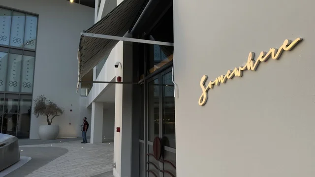 Somewhere Restaurant Signage on Modern Building Exterior