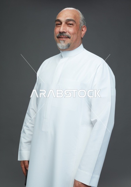 Smiling Saudi Man in Traditional White Thobe Studio