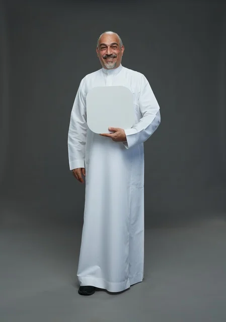 Senior Arab Man in Traditional Thobe Holding Blank Board