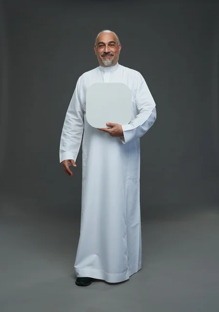 Saudi Man in Thobe Holding Blank Sign Studio Portrait