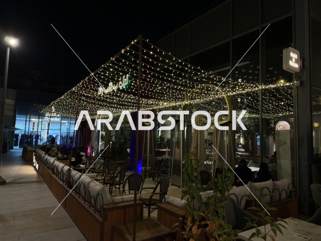 Outdoor Cafe Seating with String Lights at Night