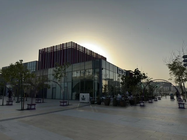 Modern Glass Building Urban Plaza at Sunset