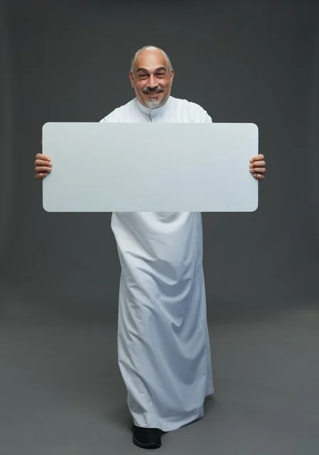 Saudi Man in Thobe Holding Blank White Sign