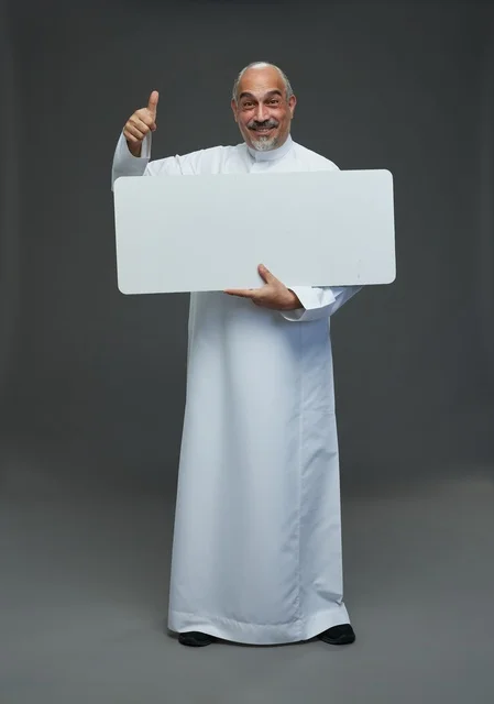 Saudi Man in Thobe Holding Blank Board with Thumbs Up