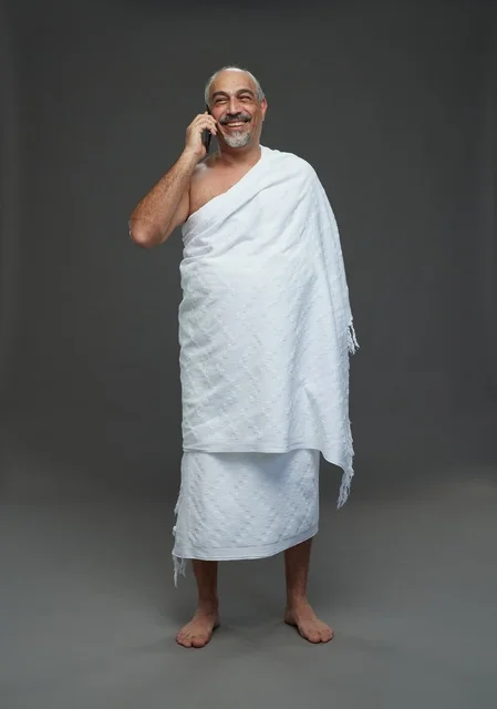 Saudi Man in Ihram Talking on Smartphone