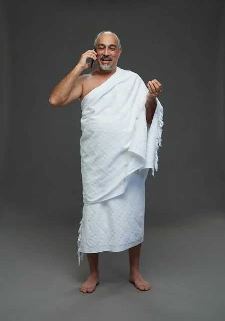 Saudi Man in Ihram Talking on Smartphone