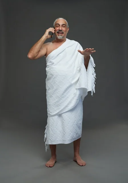 Saudi Man in Ihram Talking on Smartphone