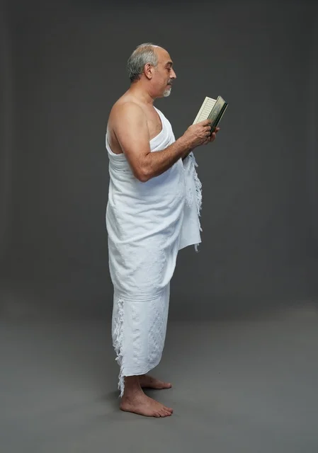 Saudi Man in Ihram Reading Quran Studio Portrait