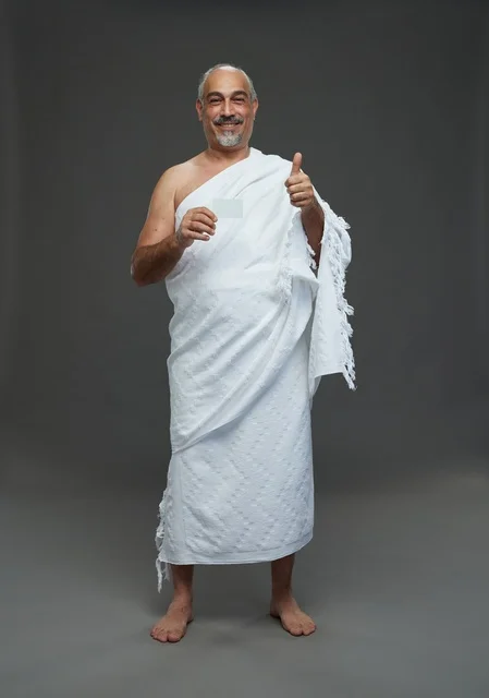 Saudi Man in Ihram Holding Blank Card Thumbs Up