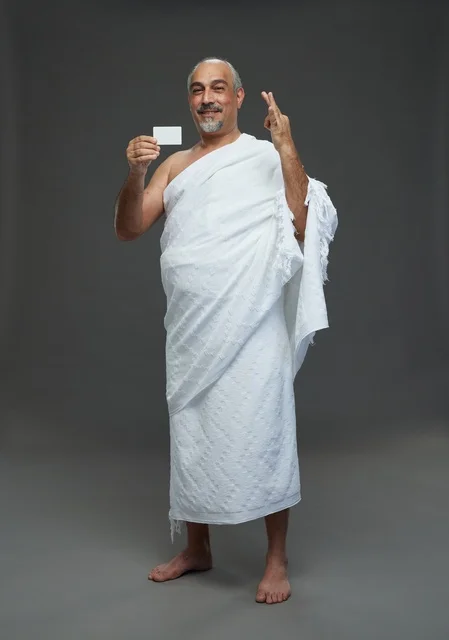 Saudi Man in Ihram Holding Blank Card Studio