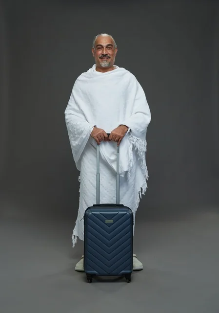 Saudi Man in Ihram with Suitcase for Hajj and Umrah