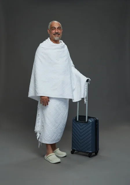 Saudi Man in Ihram with Suitcase for Hajj Rituals