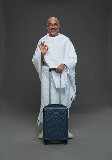 Saudi Man in Ihram Clothes with Suitcase for Hajj