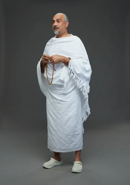 Saudi Man in Ihram Holding Prayer Beads Studio Shot