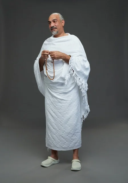 Saudi Man in Ihram Holding Misbaha Prayer Beads Hajj