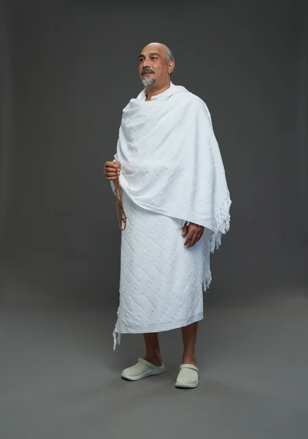 Saudi Man in Ihram Holding Prayer Beads Studio Shot
