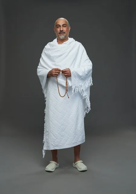 Saudi Man in Ihram Clothing Holding Prayer Beads Studio