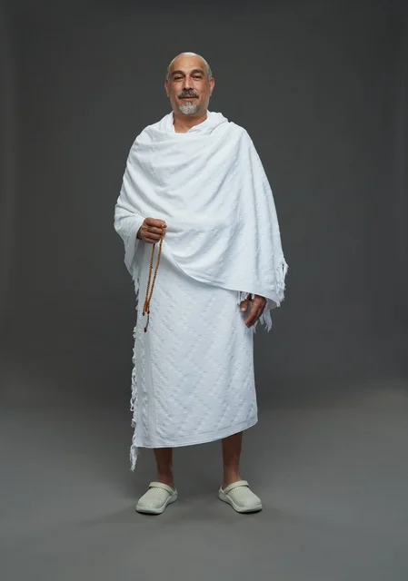 Saudi Man in Ihram Clothing Holding Prayer Beads