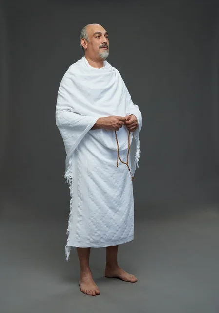 Saudi Man in Ihram Clothing with Prayer Beads Studio Shot