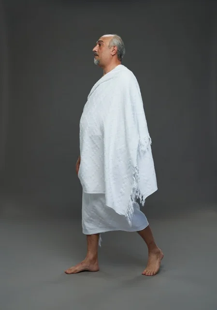 Saudi Man in Ihram Clothing Walking in Studio