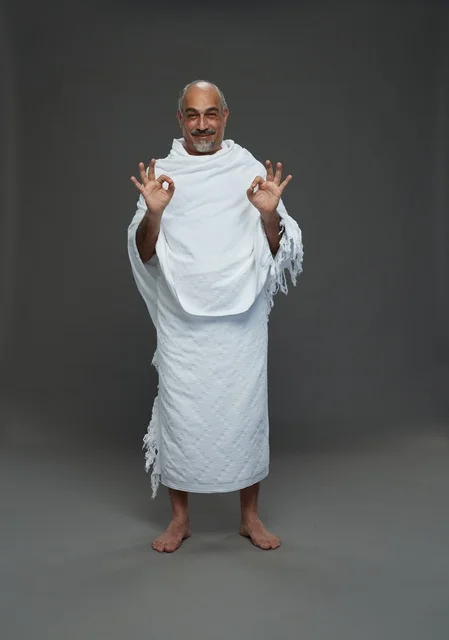 Saudi Man in Ihram Hajj Rituals Making OK Gesture Studio