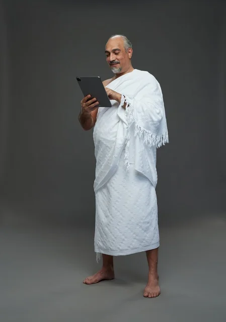 Saudi Man in Ihram Using Digital Tablet Studio