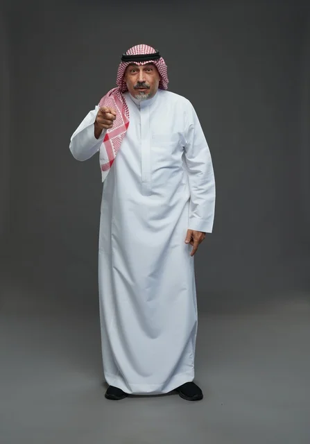 Saudi man in traditional attire with shemagh and agal