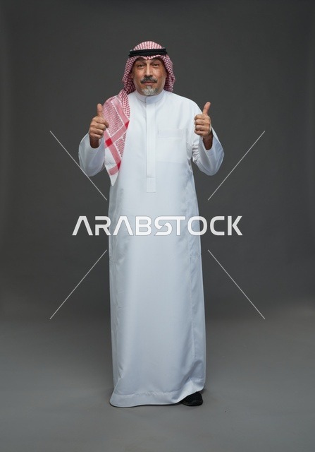 Saudi Man in Traditional Dress with Thumbs Up Gesture