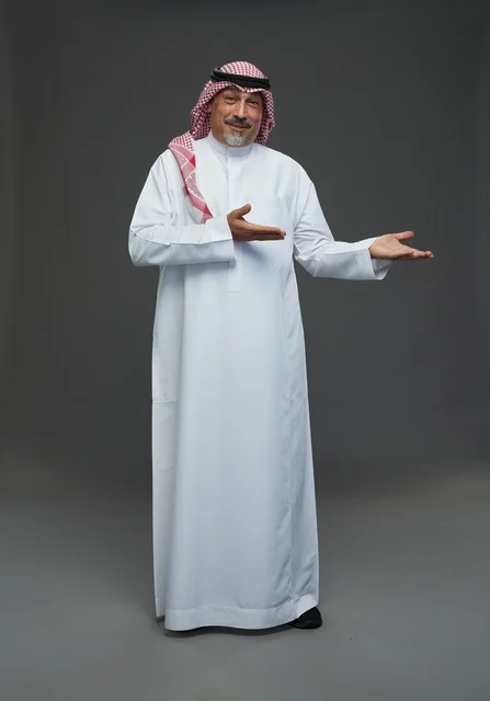 Saudi Man in Traditional Dress Gesturing in Studio