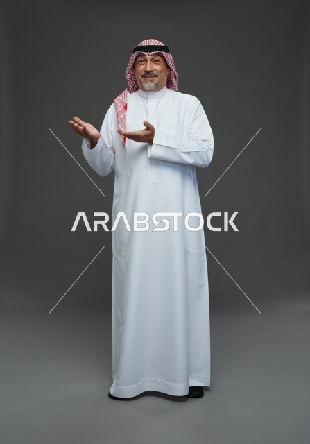 Saudi Man in Traditional Dress Gesturing in Studio
