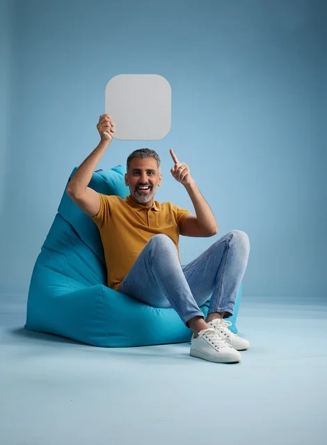Saudi Man Holding Blank Mockup Sign in Studio