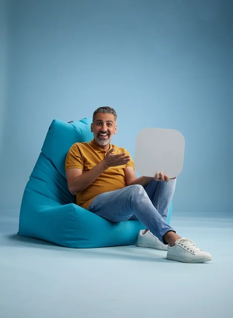 Saudi Man Holding Blank Mockup Board on Blue Background