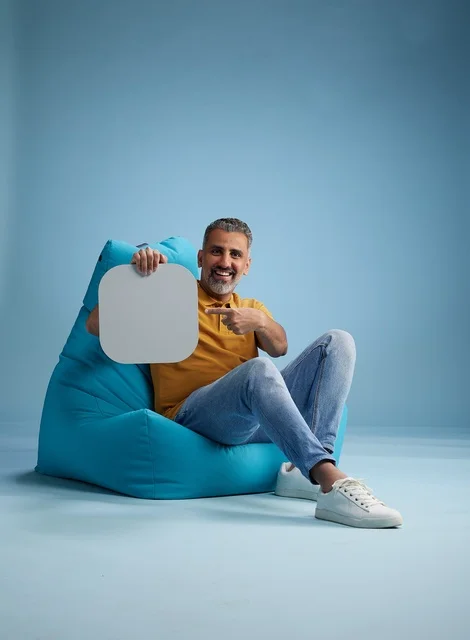 Saudi Man Holding Blank White Mockup Board in Studio Saudi Man Holding Blank White Mockup Board in Studio