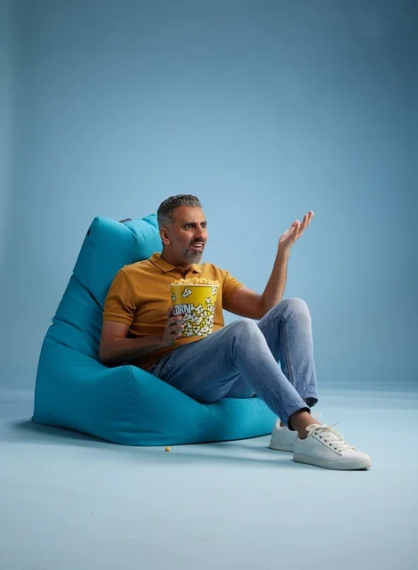 Saudi Man Eating Popcorn in Beanbag Chair