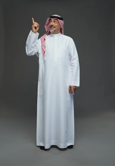Saudi Man in Traditional Dress Pointing Upward