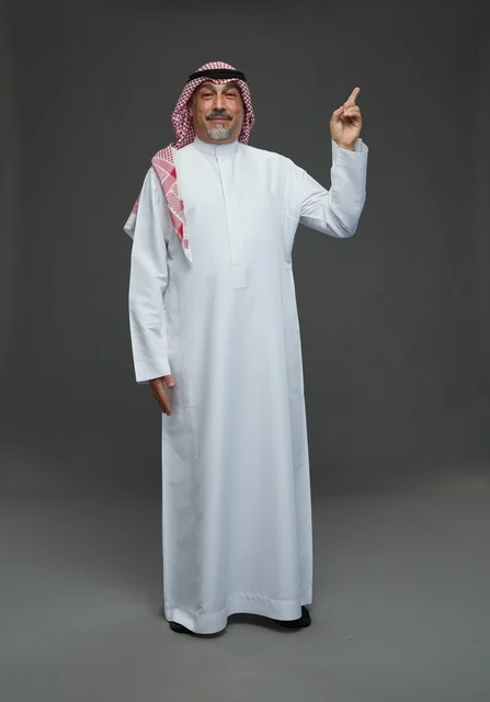 Saudi Man in Traditional Thobe Pointing Upward
