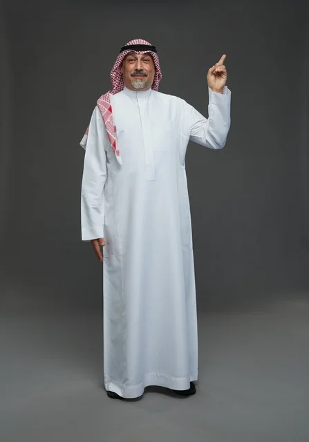 Saudi Man in Traditional Dress Pointing Upwards