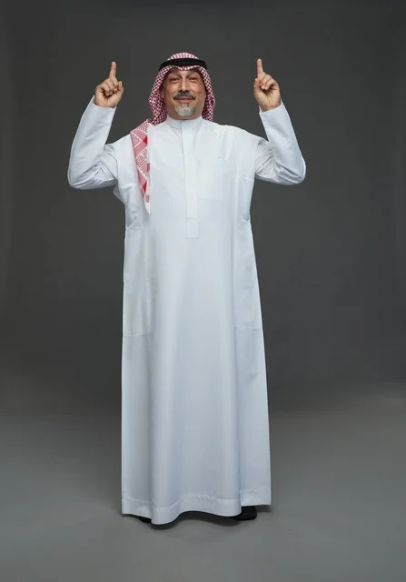 Saudi Man in Traditional Thobe Pointing Upward