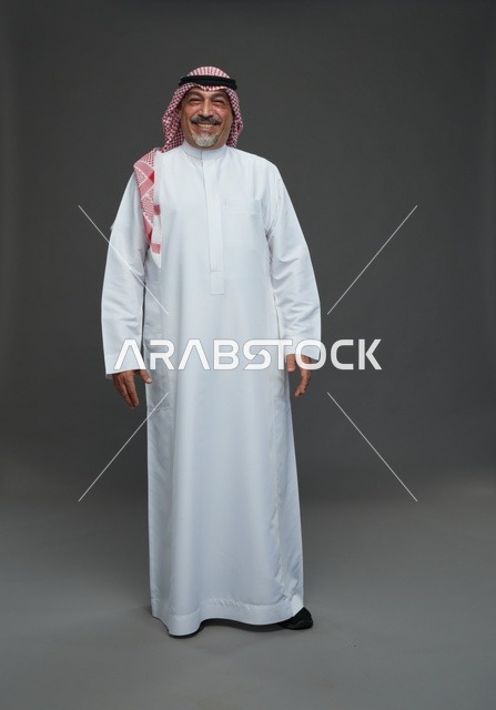 Saudi Man in Traditional Dress on Grey Background
