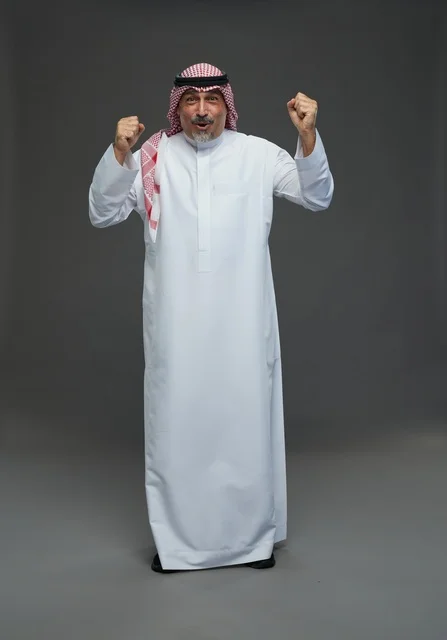 Saudi Man in Traditional Dress Celebrating Victory