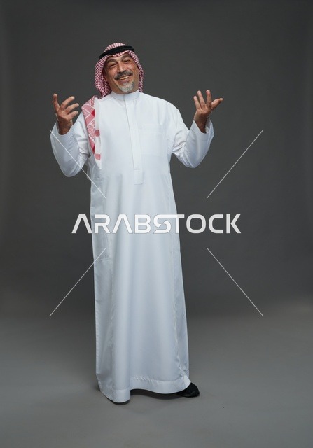 Saudi Man in Traditional Dress on Grey Background