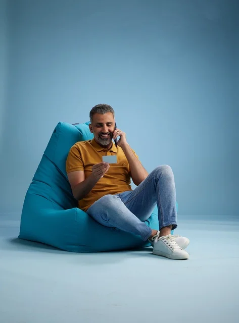 Saudi Man with Credit Card and Phone in Studio