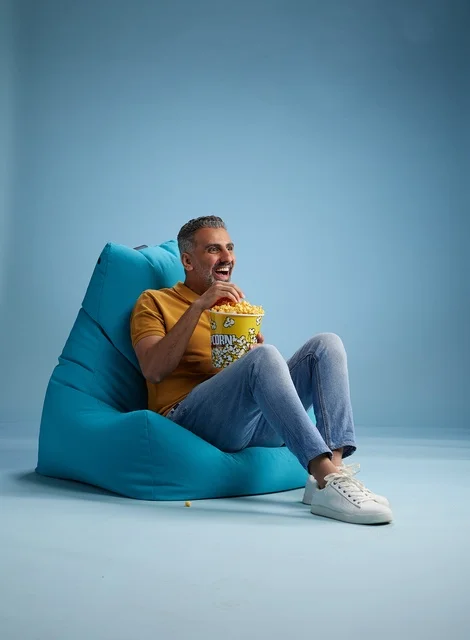 Saudi Man Eating Popcorn in Beanbag Chair